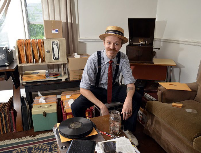 Lon Eldridge with a 1905 Victor V-2 phonograph at his Chattanooga home. Mr Eldridge collects vinyl records and restores phonographs. Thursday Aug 20, 2016 (Photo by Billy Weeks)