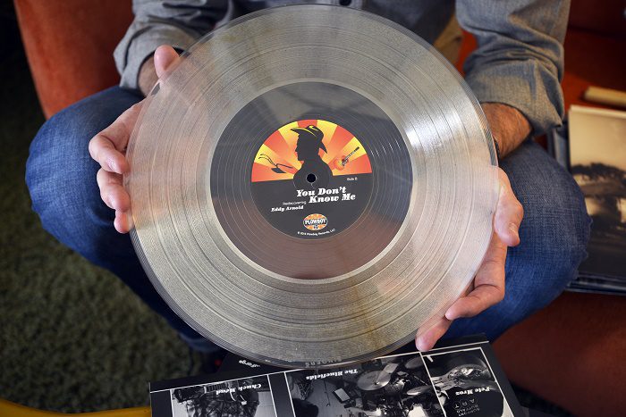 Shannon Pollard holds a album at his studio in Nashville, Tennessee. Mr Pollard is the grandson of country music singer Eddy Aronald. Tues July 26, 2016 (Photo by Billy Weeks)